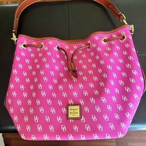 Beautiful Dooney and Burke bucket bag with strap.